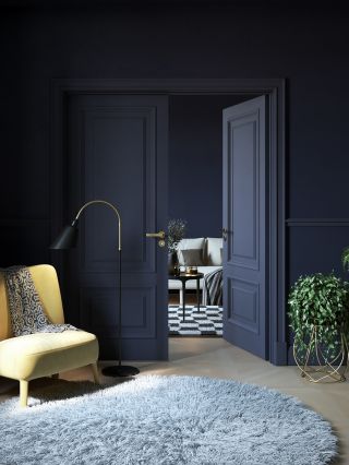 navy blue living room with light wooden parquet flooring and a shaggy grey rug